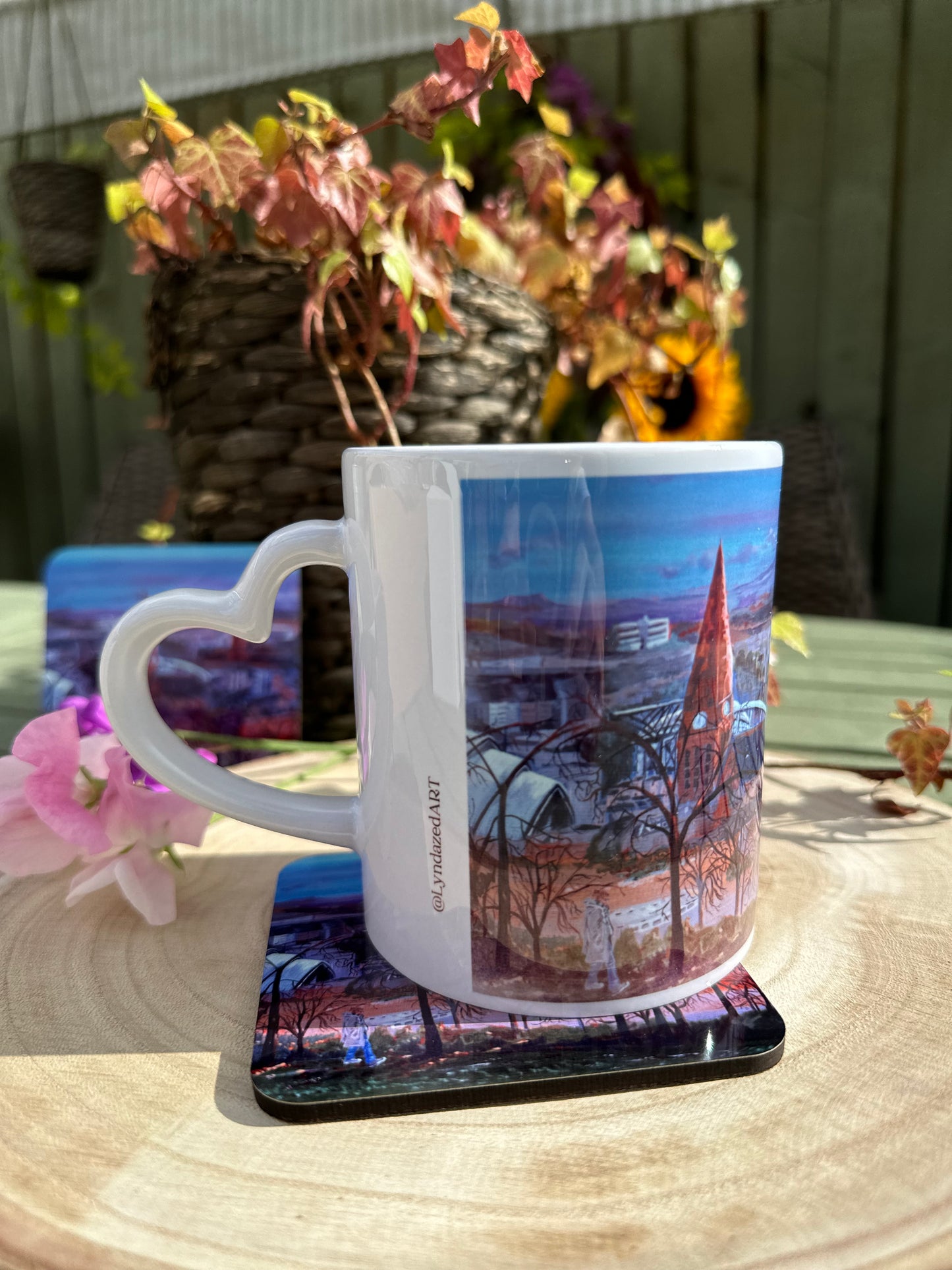Mug and Coaster set Queens Park Viewpoint mug on coaster hand left detail