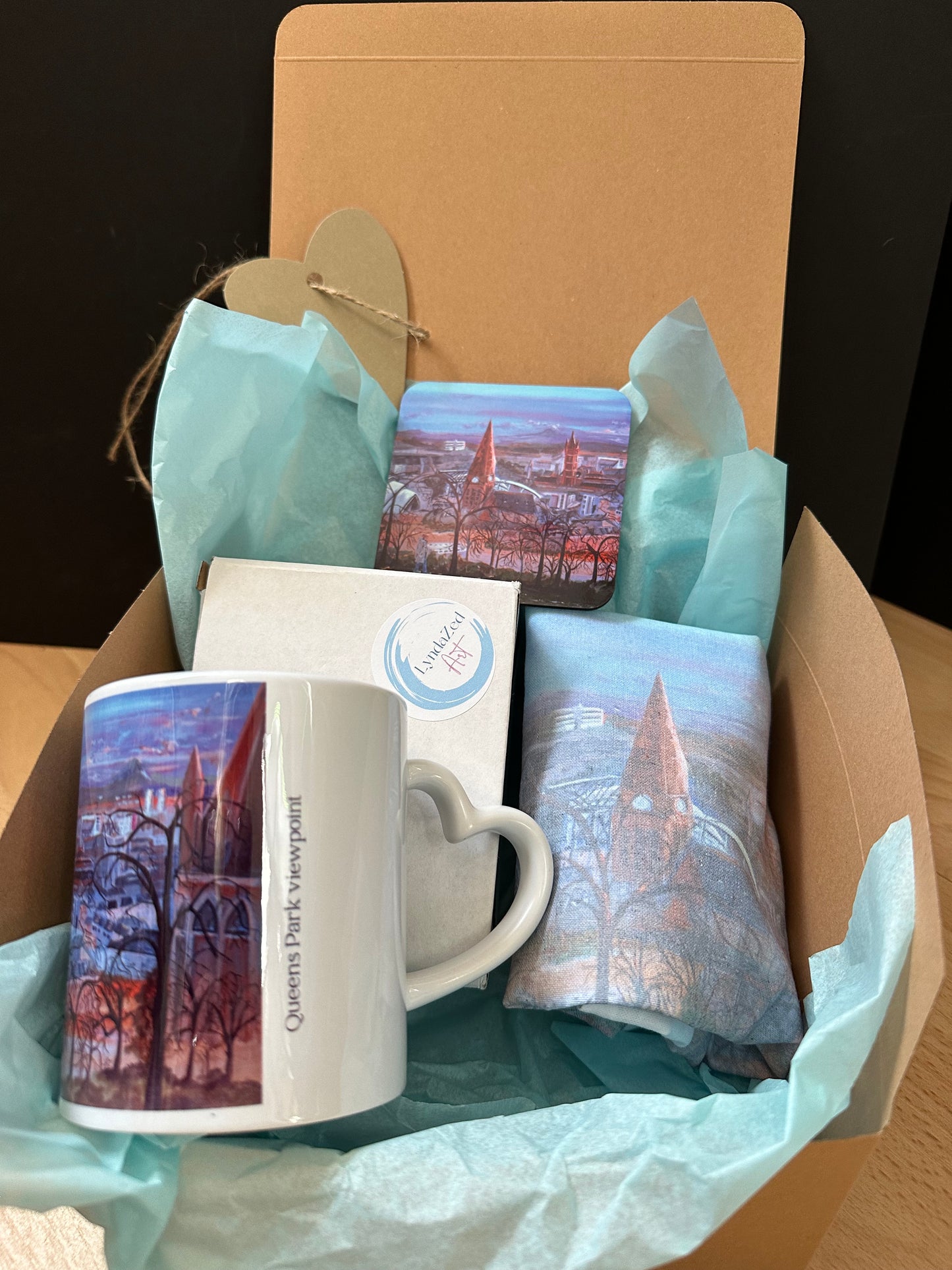 Giftbox Glasgow Queens Park Viewpoint showing right heart handle on mug with coaster and folded tote