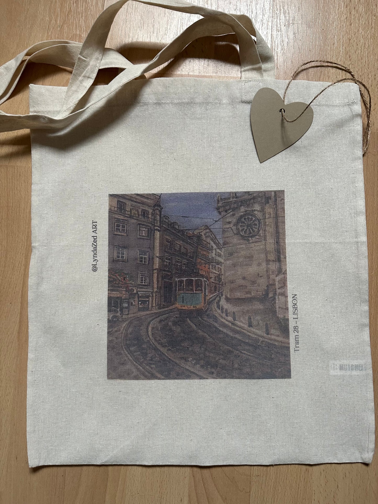 Tram 28 Lisbon giftbox showing tote bag detail of Lisbon art printed on bag