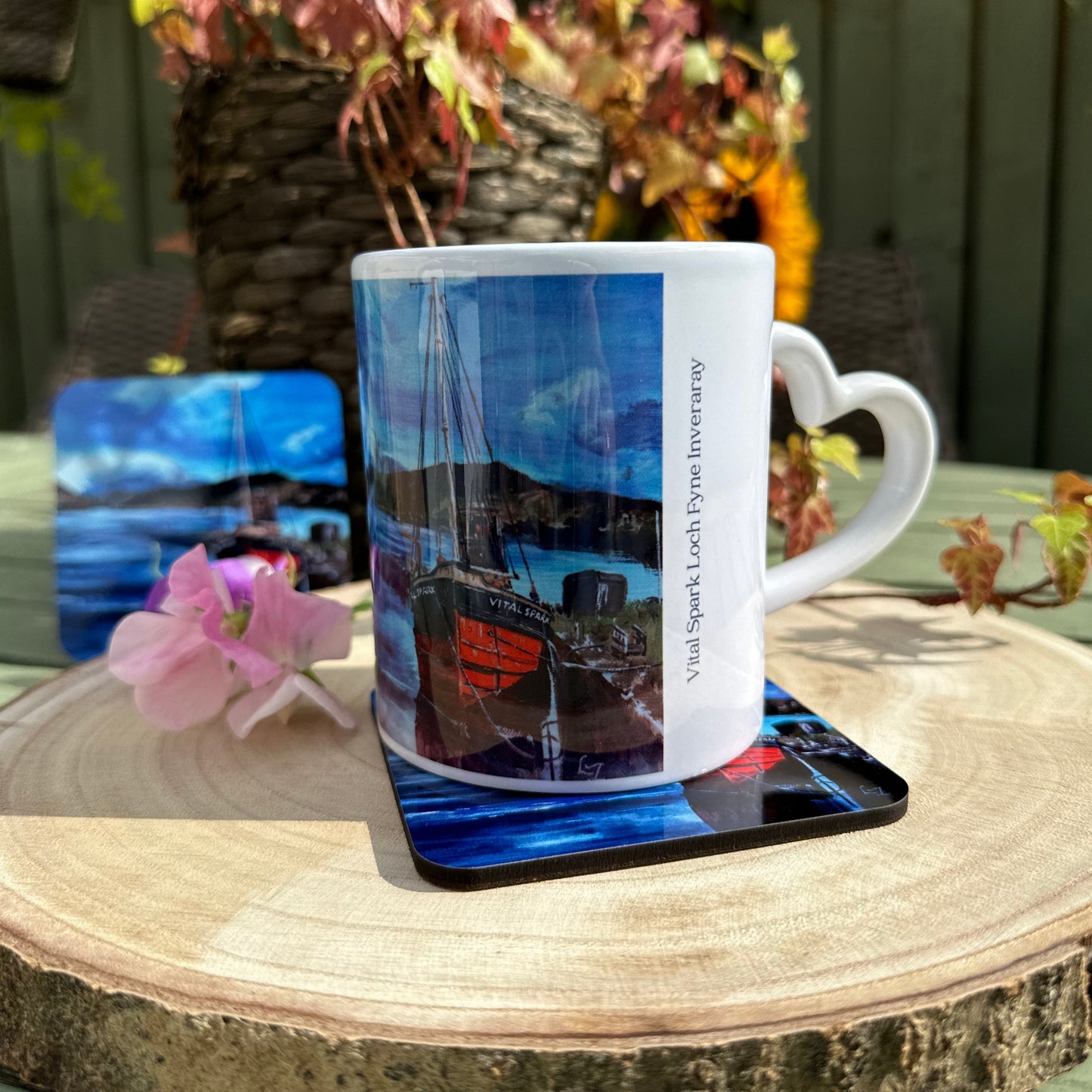 Mug and Coaster set the Vital Spark on Loch Fyne mug resting on coaster garden shot on woodslice