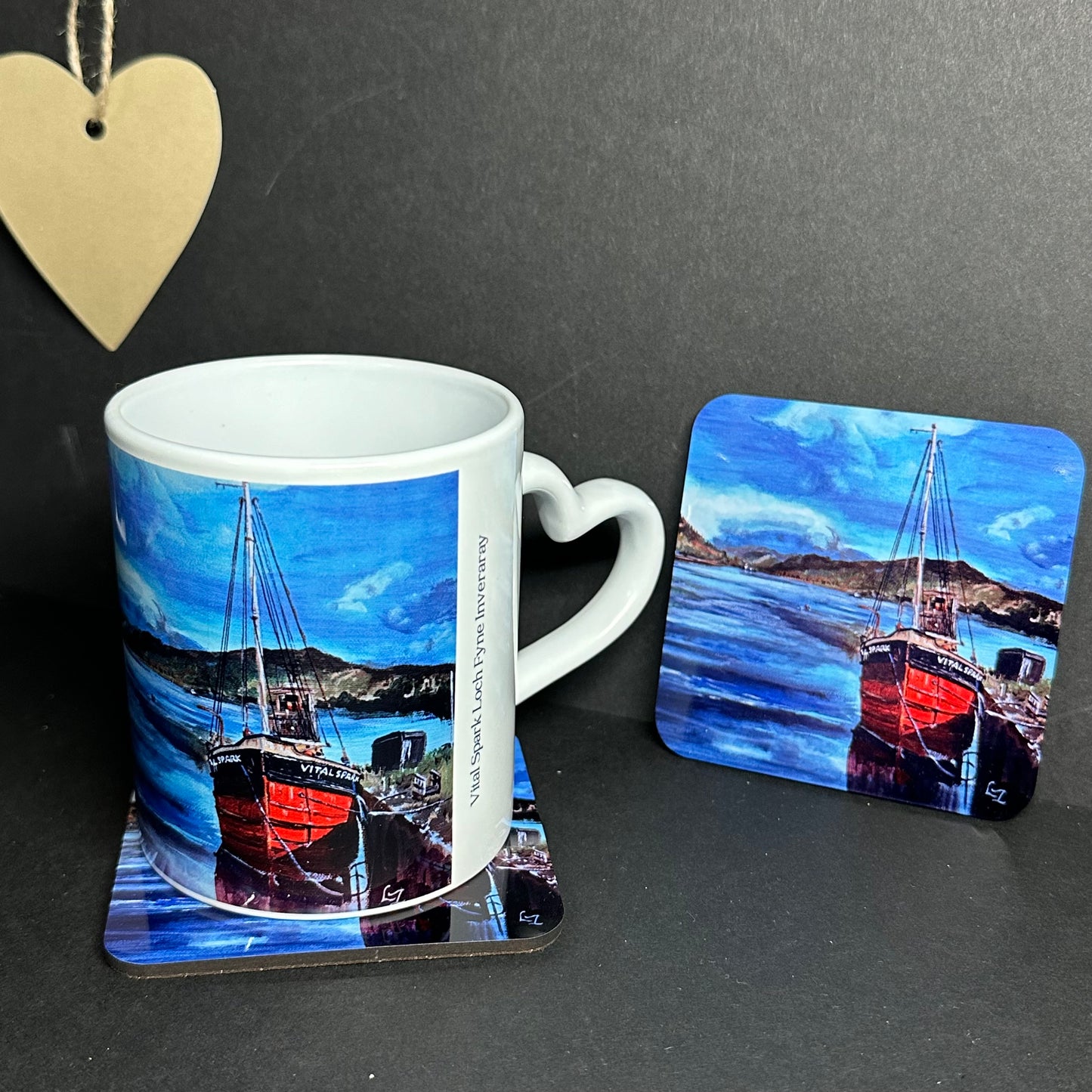 Mug and Coaster set the Vital Spark on Loch Fyne black bgd heart handle right and coaster detail