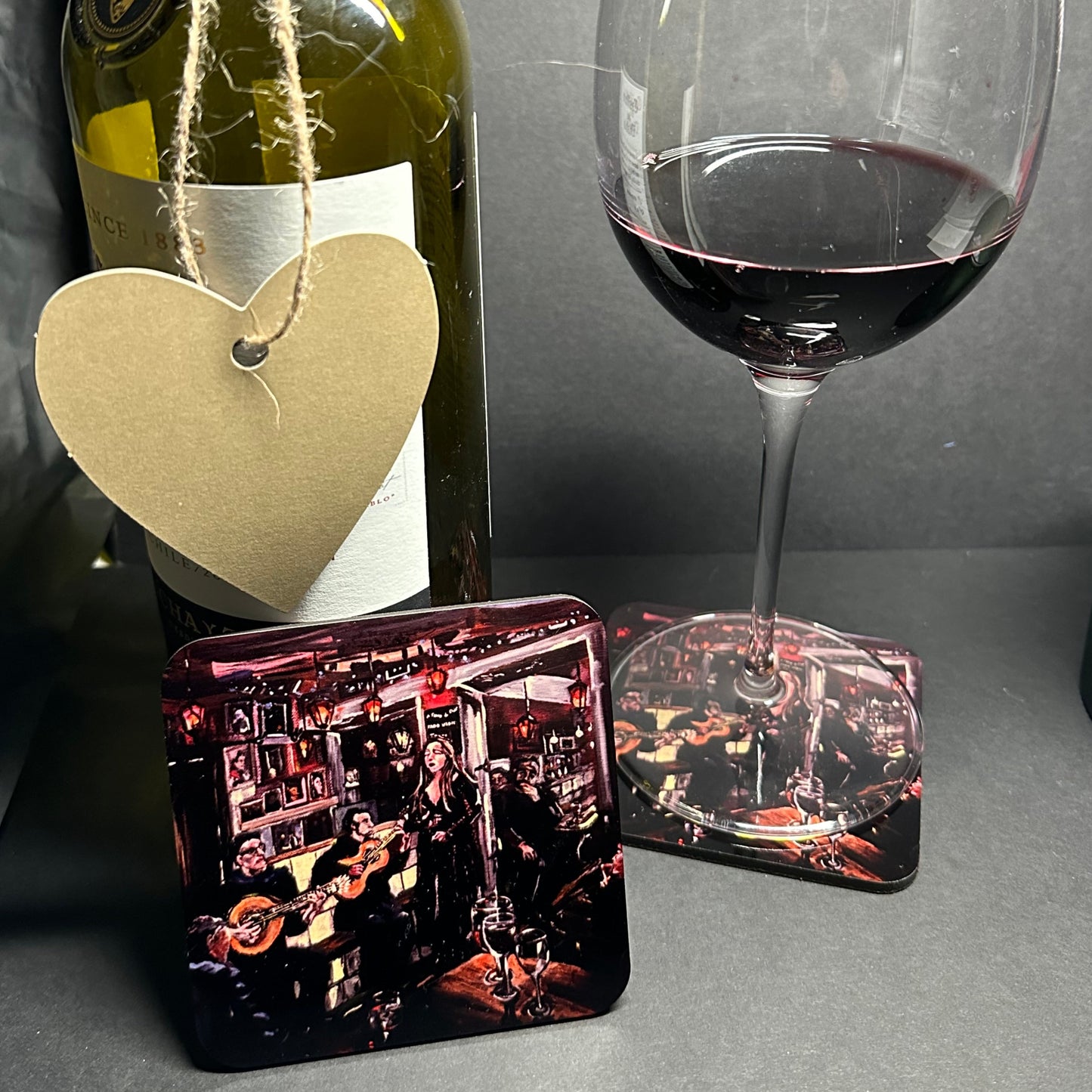 Wine glass rested on Fado Bar Lisbon Coaster with upright coaster to foreground